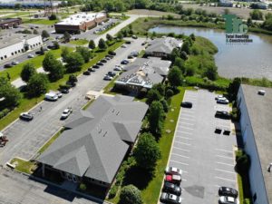 Drone footage view of a series of commercial building roofs - Total Roofing and Construction