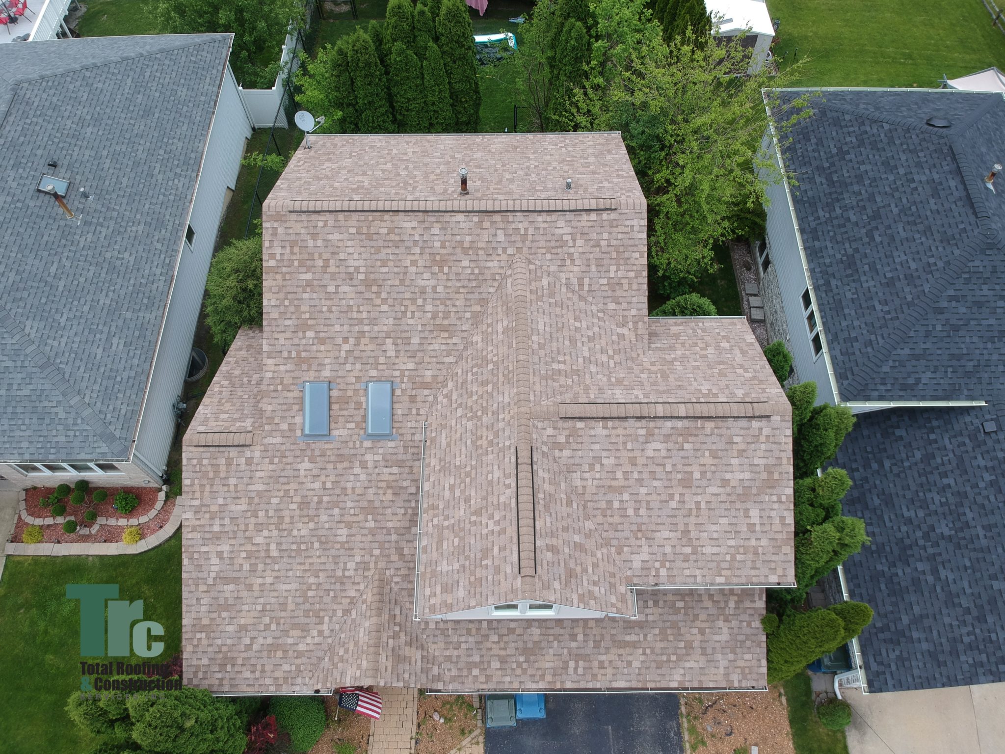 We installed an Owens Corning Duration system with ridge ventilation and Velux Skylights. 