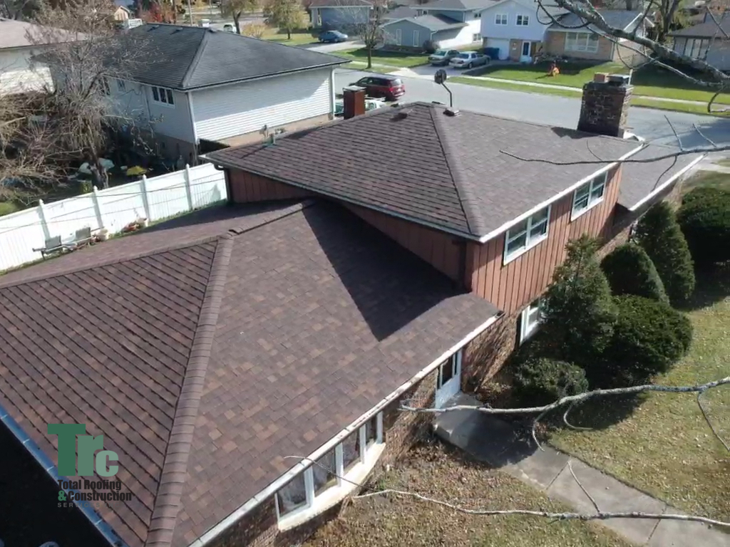 This home was damaged by a wind storm and we installed an Owens Corning Oakridge roofing system. 