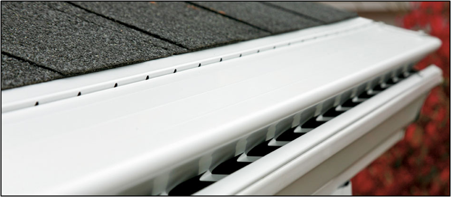 a white gutter is sitting on top of a roof .