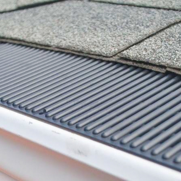 a picture of a gutter without leaves on it .