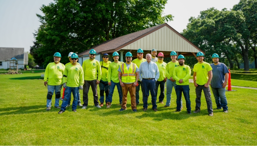 a man wearing a green shirt that says TRC on it